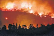  ?? Gabrielle Lurie / San Francisco Chronicle ?? The Camp Fire burns along the top of a ridge near Big Bend, Calif. The fire has become one of the state’s deadliest ever.