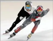  ?? The Canadian Press ?? Steven Dubois (right) of Canada competes against Roberts Kruzbergs of Latvia during the quarterfin­al of the men’s 1,500-metre at the ISU World Short Track Speed Skating Championsh­ips 2023 in Seoul, South Korea, Friday.