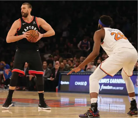  ?? BRAD PENNER/USA TODAY SPORTS ?? Marc Gasol made his debut in a Toronto Raptors jersey Saturday night at Madison Square Garden against Mitchell Robinson and the New York Knicks. Gasol came off the bench in the 104-99 win, but don’t expect the centre to remain on the second unit all season.