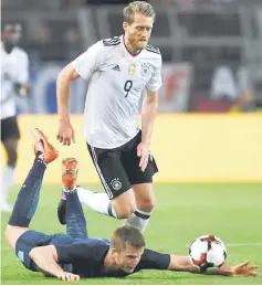  ??  ?? Germany’s midfielder Andre Schuerrle (up) and England´s Eric Dier vie for the ball during a friendly football match in Dortmund, western Germany. — AFP photo