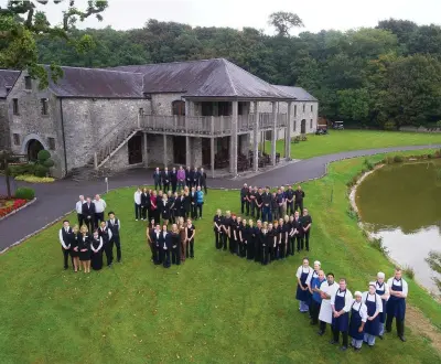  ??  ?? Staff at Fota Island Resort mark the official handover to the new owners, the Kang family, in 2013