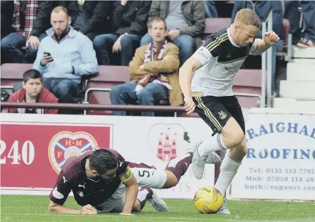  ??  ?? Adam Rooney (right) gets the better of Sunderland defender Alim Ozturk, in a Hearts-Aberdeen clash at Tynecastle in the 2015-16 season.