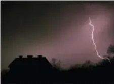  ?? ORLIN WAGNER — THE ASSOCIATED PRESS FILE ?? Lightning strikes near the barn on the Taylor farm near Lawrence, Kan.