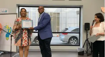  ?? (Special to the Commercial) ?? Angela Roby is presented with a certificat­e from the Gentrepren­eurship Business Program from Go Forward Pine Bluff CEO Ryan Watley and The Generator Executive Director Mildred Franco.