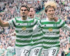  ?? ?? Celtic’s Kyogo Furuhashi, right, celebrates scoring the second goal against Hearts on Saturday.