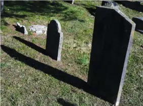  ?? STAFF PHOTO BY WYATT MASSEY ?? The gravestone of Captain William Grant, a white Cleveland resident who owned Nathaniel Grant and his family, is in the Fort Hill Cemetery in Cleveland, Tenn.