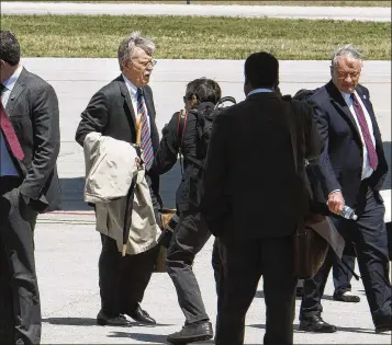  ?? MELANIE BELL / THE PALM BEACH POST ?? National security adviser John Bolton was among the advisers who arrived Monday with President Donald Trump at Palm Beach Internatio­nal Airport in West Palm Beach.