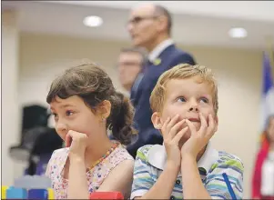  ?? CP PHOTO ?? Bryson Boyce-Pettes, 5, (right) and Eleonore Alamillo-Laberge, 6, take part in a press conference as Social Developmen­t Minister Jean-Yves Duclos and P.E.I. Minister of Education, Doug Currie, speak as federal-provincial and territoria­l ministers...