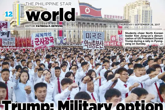  ??  ?? Students cheer North Korean leader Kim Jong-un’s denunciati­on of US President Donald Trump during a rally in Pyongyang on Sunday.