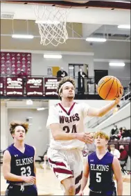  ?? MARK HUMPHREY ENTERPRISE-LEADER ?? Lincoln senior Austin Munyon finishes a drive to the basket with a left-handed layup during a 3A-1 Conference boys basketball game at Wolfpack Arena on Friday, Jan. 15. The Wolves lost 67-51.