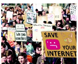  ?? AP ?? In this Saturday, March 23, 2019 photo, people protest against the copyright bill in Leipzig, Germany.