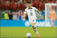  ?? Francisco Seco / Associated Press ?? Christian Pulisic of the United States runs with the ball during the World Cup, group B soccer match between the United States and Wales at the Ahmad Bin Ali Stadium Monday in Doha, Qatar.