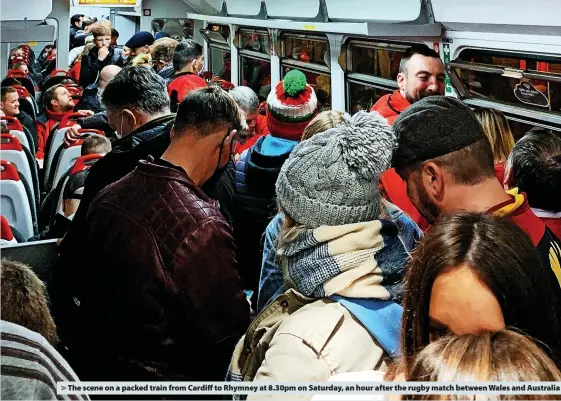  ?? ?? The scene on a packed train from Cardiff to Rhymney at 8.30pm on Saturday, an hour after the rugby match between Wales and Australia