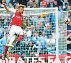  ?? AP ?? Arsenal’s Laurent Koscielny (front) is challenged by Manchester City’s Nicolas Otamendi during the English FA Cup semi-final at Wembley Stadium in London on Sunday.