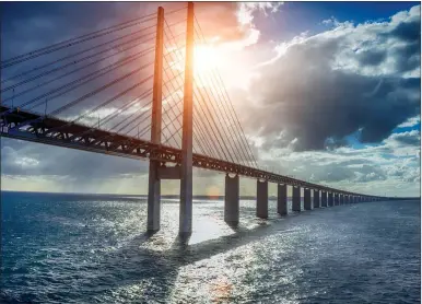  ??  ?? „ The Oresund Bridge between Denmark and Sweden helps connect the two Scandinavi­an countries.