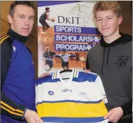  ??  ?? Neil Kerr receives his All-Star jersey from Oisin McConville.