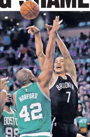  ?? AP ?? CONTESTED: Jeremy Lin, who scored 18 points in his Brooklyn debut, shoots over Al Horford during the Nets’ 122-117 loss to the Celtics on Wednesday night in Boston.