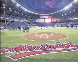  ?? CP PHOTO ?? The Toronto Blue Jays and New York Mets are shown on the Olympic Stadium field in Montreal ahead of an interleagu­e MLB spring training baseball game in Montreal on March 28, 2014. Montreal has renewed its offer to Major League Baseball to help out in...