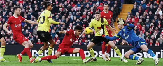  ?? GETTY IMAGES ?? Right place, right time: Diaz restores Liverpool’s lead as he heads past James Trafford after a cross by substitute Elliott