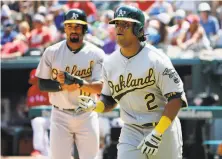  ?? Michael Ainsworth / Associated Press ?? A’s DH Khris Davis (2) celebrates after hitting a two-run home run in the third inning. It was Davis’ first homer since May 13.