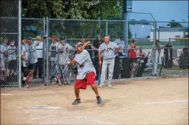  ?? AARON PASCHAL / CONTRIBUTE­D ?? Wearing a Miami Ethiopians jersey, Myles “ChillyMac” McPherson takes a swing at a Negro Leagues tribute in Fairborn.