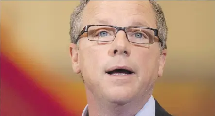  ?? THE CANADIAN PRESS/ FILES ?? Saskatchew­an Premier Brad Wall says his province benefited the last time Alberta reviewed its royalties.