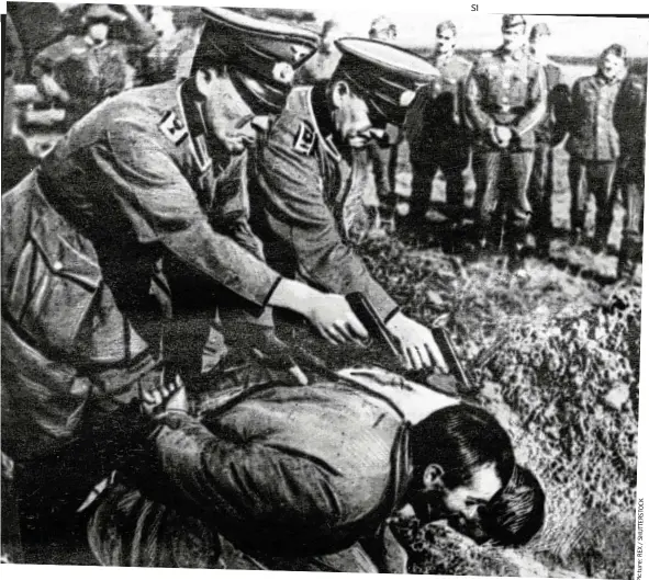  ?? K C O T S R E TT U H S
/ X E R : e r u t c i P ?? Brutal: Gestapo officers execute Russian peasants