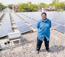  ?? JIM MONE/AP ?? Bishop Richard Howell Jr. stands among hundreds of panels on the roof of Shiloh Temple Internatio­nal Ministries, also a “community solar” provider, in Minneapoli­s.