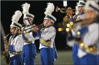  ?? Photo by Mark Stockwell ?? The Attleboro High School Marching Band performs a half-time routine at a September 2019 football game.