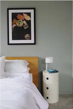 ??  ?? LEFT This wall in the master bedroom, painted in Dulux White Island Double, is beautified by a photograph­ic print, Float, by Keryn Sweeney from The Market NZ. BELOW The couple carved out some space in the kids’ lounge (painted in Dulux Masterton) to...