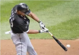  ?? MORRY GASH/AP ?? Jose Abreu comes through with an RBI single in the seventh for the lead.