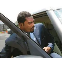  ?? FILE ?? Former NFL quarterbac­k Michael Vick gets into a waiting car after a 2019 bankruptcy hearing at Norfolk Federal Court. Vick is being sued in Broward County for outstandin­g loan debts.