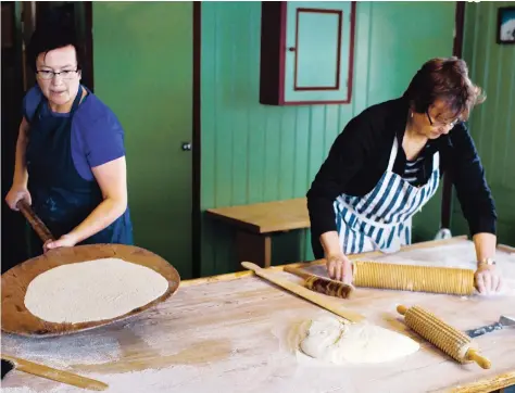  ?? PHOTOS: MAGNUS NILSSON/PHAIDON ?? Chef and cookbook author Magnus Nilsson’s mom and aunt make flatbread in Sweden during the winter of 2013.