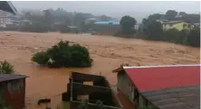  ?? AP ?? Mud and water flow in Freetown, where hundreds have died and many more are feared to have been killed in the deluge