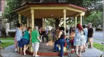  ?? CONTRIBUTE­D BY MICHELE RUTHERFORD ?? Bastrop County residents gathered Sunday night to honor victims of violent protests in Charlottes­ville, Va. Participan­ts lit candles and held a moment of silence.