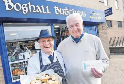  ?? ?? Well done to John Gaffney from Kirkliston, who is this week’s winner of our Butcher Boy competitio­n. John is pictured with Paul Boyle of Boghall Butchers. Just keep an eye out for the Butcher Boy in this week’s Courier for your chance to win.