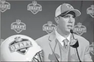  ?? AP-Frank Franklin II, File ?? Matt Ryan, a quarterbac­k from Boston College, speaks at a news conference after being selected third overall by the Atlanta Falcons during the first round of the NFL football draft in New York in 2008.