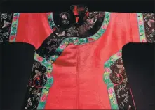  ??  ?? A Manchurian robe is the first thing to greet visitors at Shanghai History Museum’s qipao exhibition.