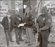  ?? Contribute­d ?? Many thanks go out to the local Walmart team that assisted us with the “Santa in Uniform” project: Sarah Tilley, Walmart AP Coach and Tien Trinh, Walmart Manager. Also pictured are Sgt. Christy Nicholson and Major Ken Carson with the Calhoun Police Department.