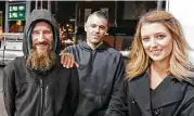  ?? Associated Press file ?? Kate McClure and her boyfriend, Mark D’Amico, center, set up a GoFundMe page for Johnny Bobbitt, a homeless veteran who helped her get gas one night.