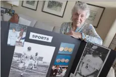  ?? AFP photos ?? Russell poses with a presentati­on boards about her father’s story, at her Home in Oakville, Ontario, Canada. —