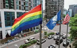  ?? Tyler Sizemore/Hearst Connecticu­t Media ?? A rainbow flag flies outside the Government Center in Stamford on June 2, 2022. A recently released UConn study shows that the emotional and physical risk for LGBTQ+ youth who are outed without their consent is real.