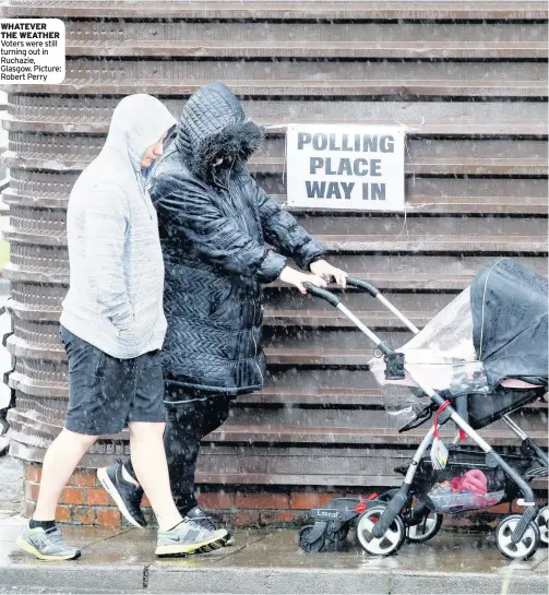  ??  ?? WHATEVER THE WEATHER Voters were still turning out in Ruchazie, Glasgow. Picture: Robert Perry