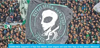  ??  ?? CASABLANCA: Supporters of Raja Club Athletic chant slogans and wave their flags as they attend a Moroccan Botola football match between Raja and Mouloudia Oujda in Casablanca on January 22, 2020.