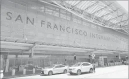  ?? Associated Press ?? Vehicles wait outside the internatio­nal terminal at San Francisco Internatio­nal Airport on Tuesday in San Francisco. Federal safety officials are investigat­ing why an Air Canada jet nearly landed on a taxiway last Friday holding four other planes...