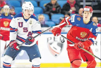  ?? CP PHOTO VIA AP, FILE ?? In this Tuesday, Jan. 2, 2018, file photo, United States forward Casey Mittelstad­t (11) and Russia forward Mikhail Maltsev (13) vie for the puck during the first period of a quarter-final game at the world junior hockey championsh­ip in Buffalo, N.Y.