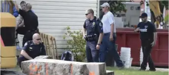  ??  ?? MILTON, Pennsylvan­ia: In this 2017 photo, police officers look over a slab of concrete pulled out of the basement of a home. — AP