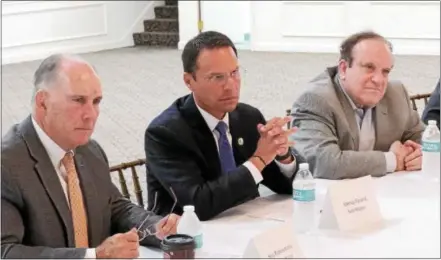  ?? SUBMITTED PHOTO ?? State Rep. Steve Barrar (left) and state Sen. Andy Dinniman (right) join in a round table discussion in Kennett Square with Pennsylvan­ia Attorney General Josh Shapiro (center) on fighting the opioid crisis.