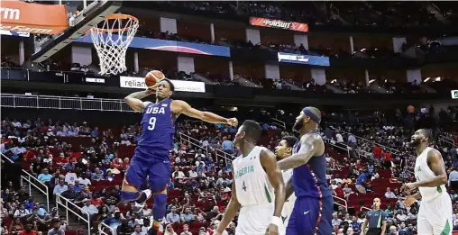  ??  ?? Show of force:
eMar eRozan of the goes for a slam dunk in an exhibition match against igeria in
ouston on Monday. won
0 . A