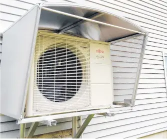  ??  ?? This air source heat pump moves excess heat out of your house during hot weather. During cold weather it works in reverse, harvesting heat from the outdoors and concentrat­ing it in your home.